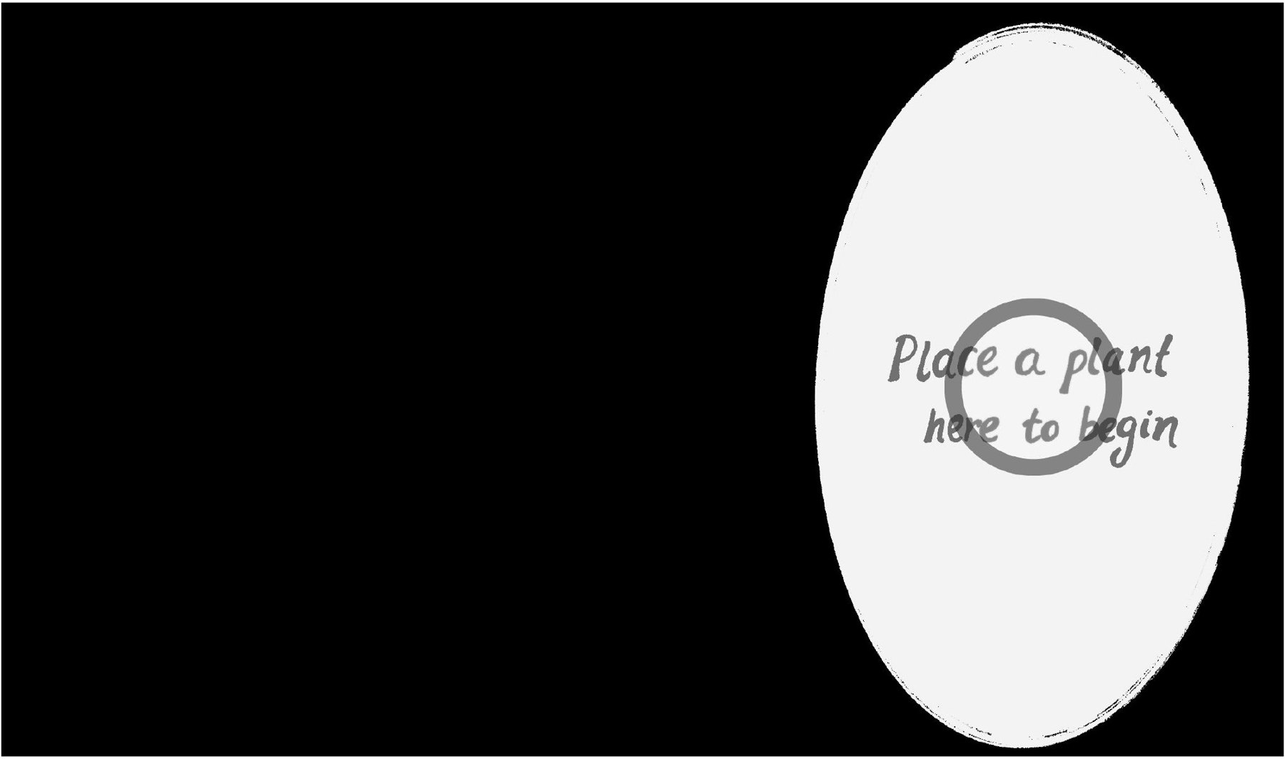 Projected table screen with a hand-lettered prompt: place a plant here to begin