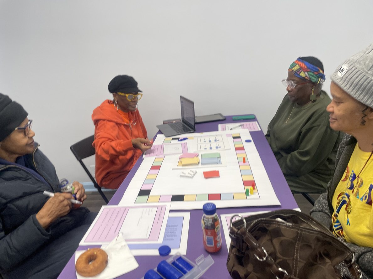 Players leaning over the board deciding on a move
