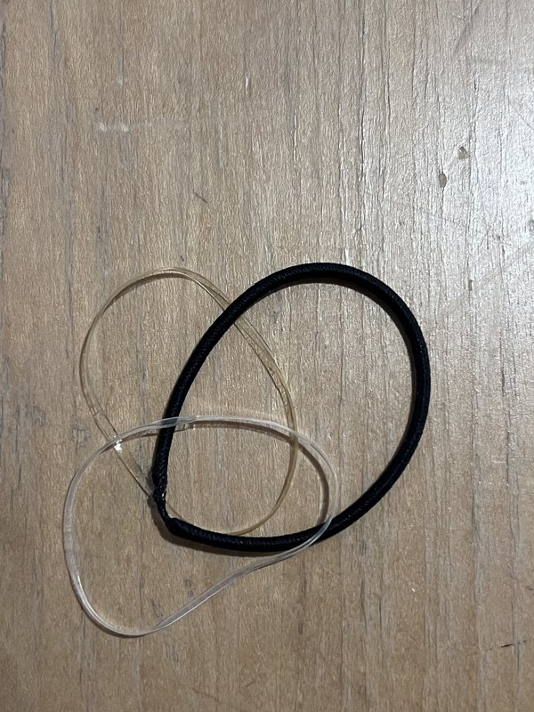 Original photo: hair ties on a wooden table
