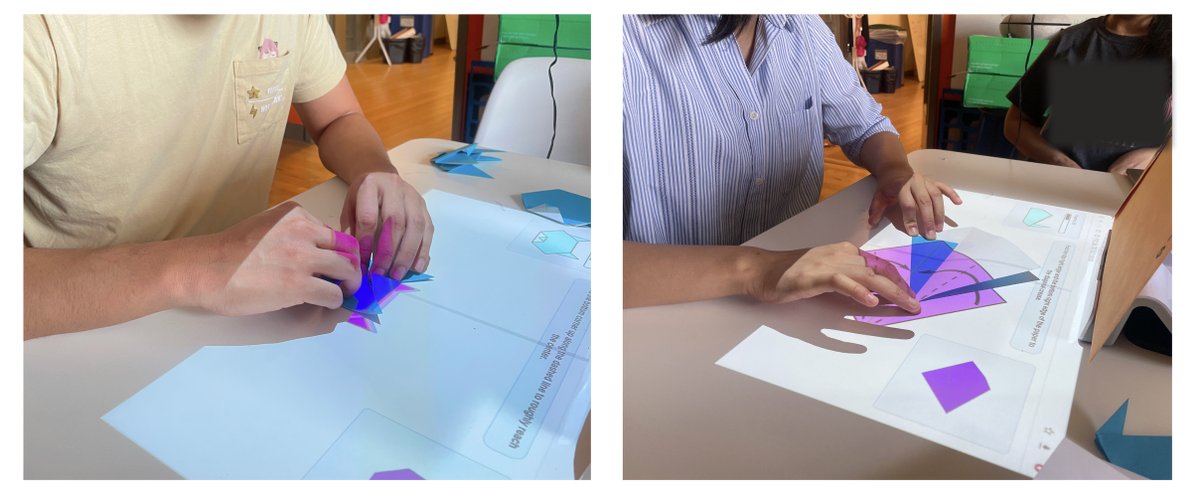 Two participants folding origami on a table with instructions projected on and around their paper