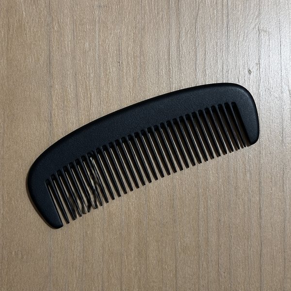 Step 1: a black comb on wood