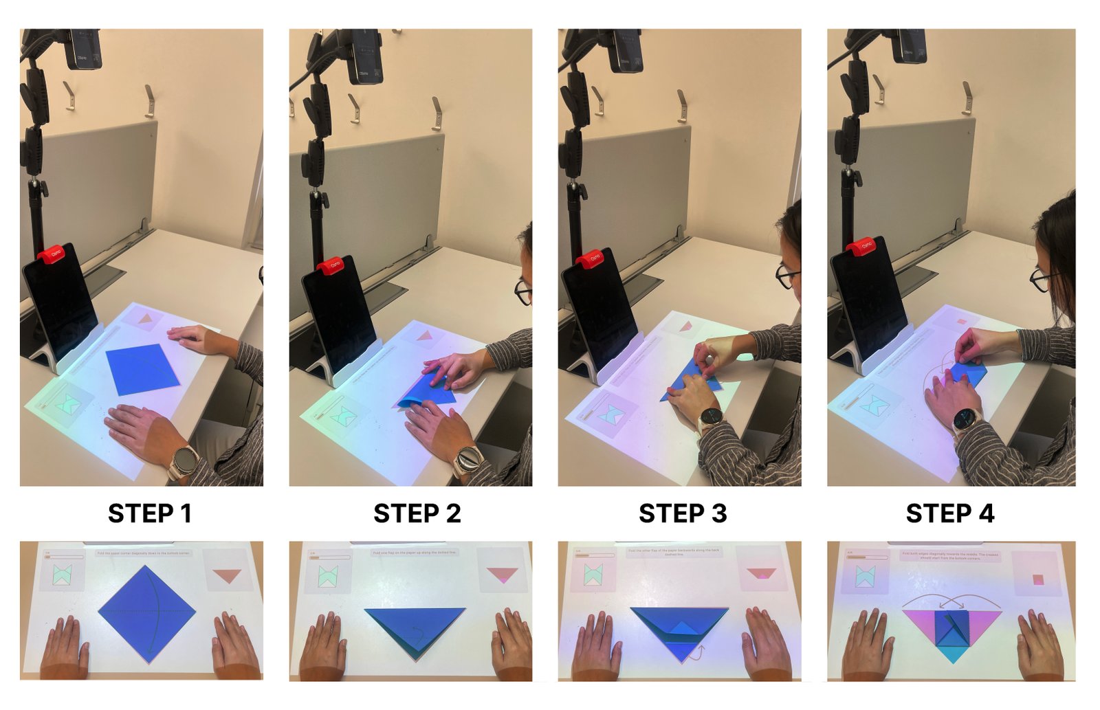 A learner folding origami while instructions are projected onto the paper